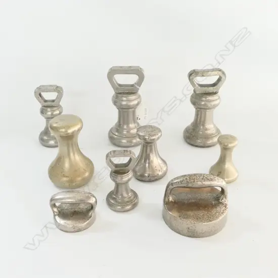 9 VARIOUS PLATED BRASS WEIGHTS (BELL & HANDLED SHAPES)